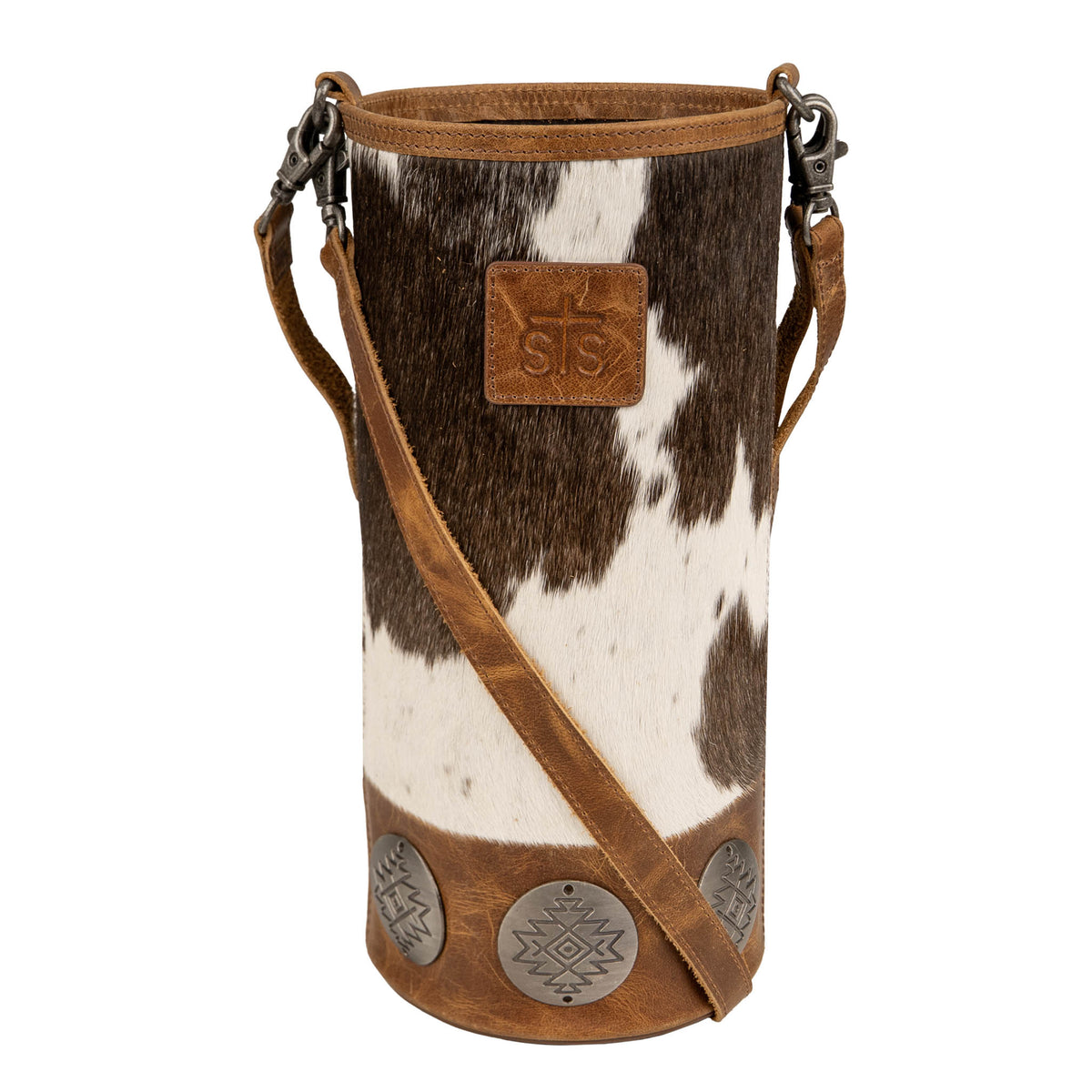 A brown and white cowhide single wine bag with leather accents, removable leather handle and crossbody straps, and concho decorations.