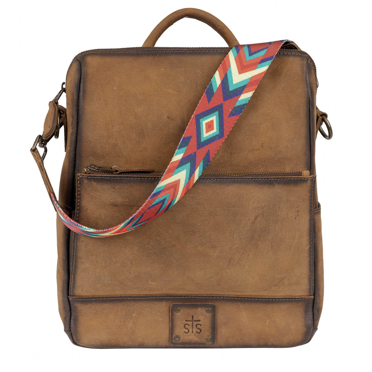 Brown leather backpack with leather handle and removable nylon shoulder strap.