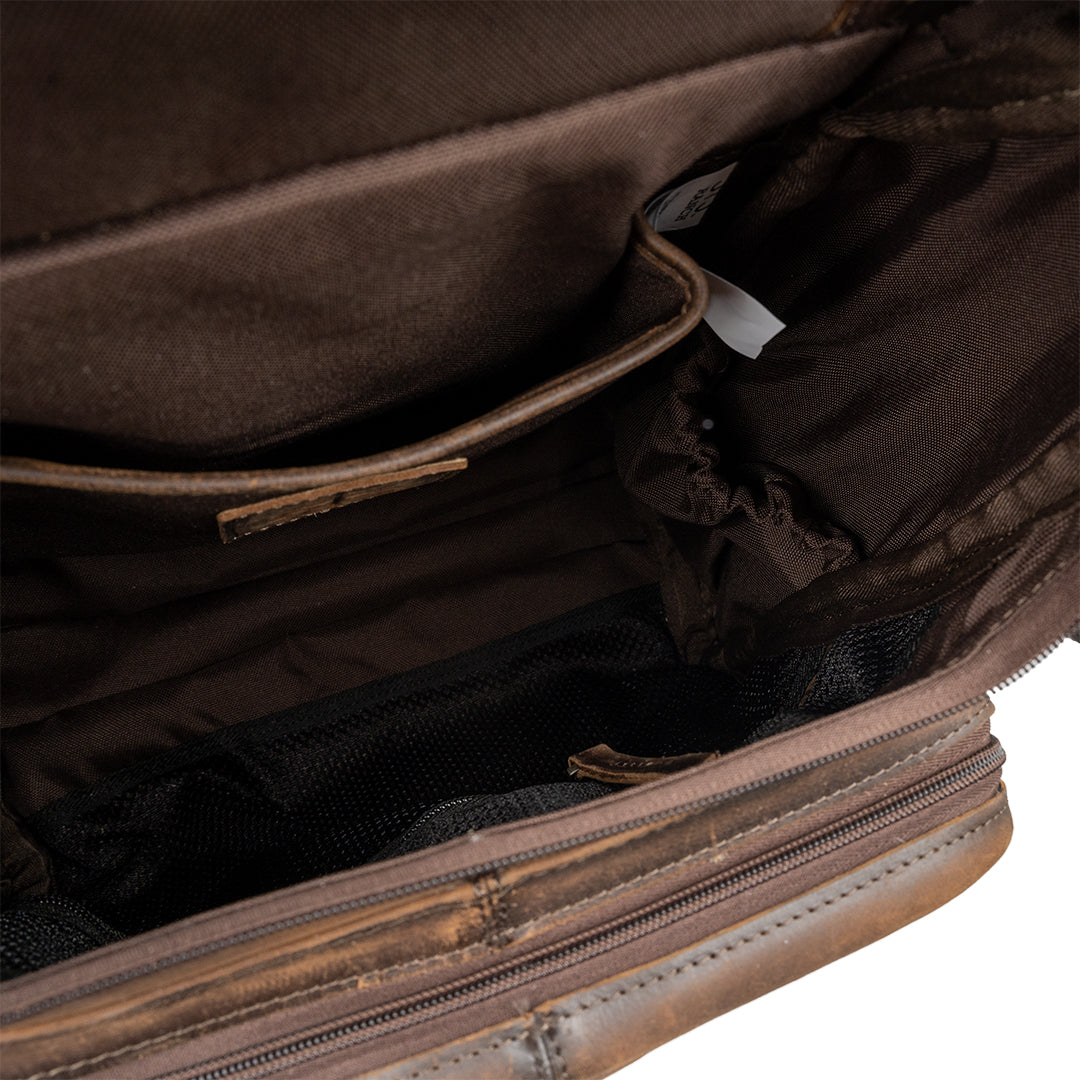 Close-up of a brown leather bag with visible stitching and texture.