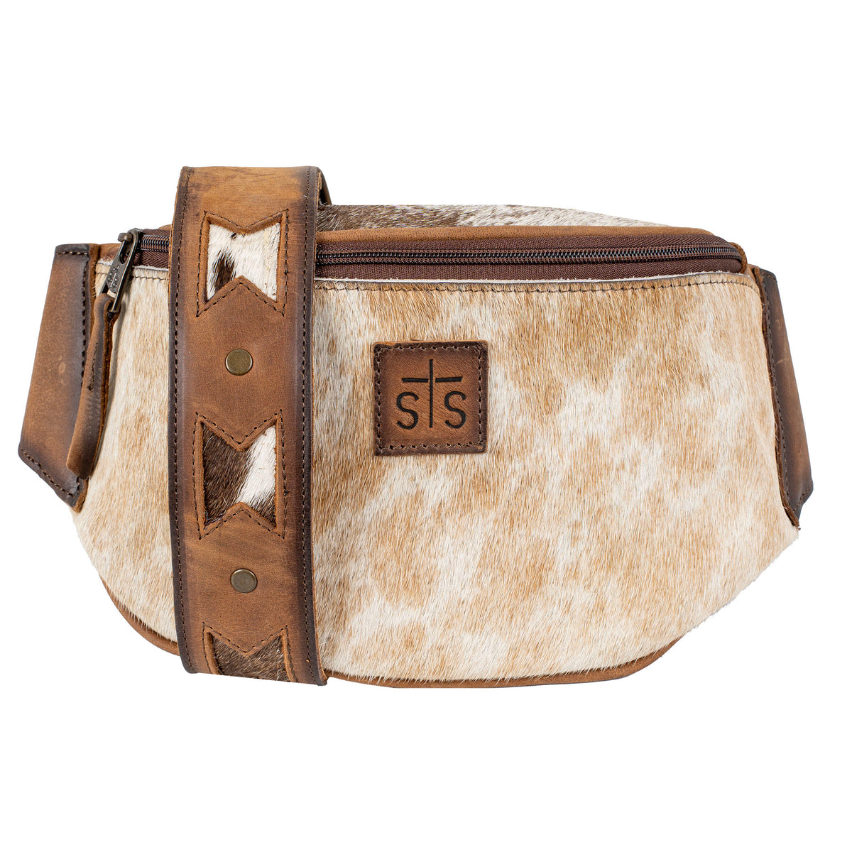 A brown and beige cowhide belt bag with full grain leather accents and a zip top closure. The bag has a removable and adjustable leather belt strap.