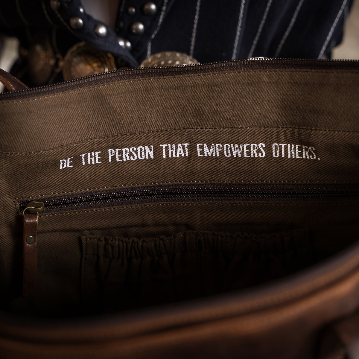 open view of our Bandera chocolate leather tote purse with buckstitch, top zip closure and magnetic buckle front pocket