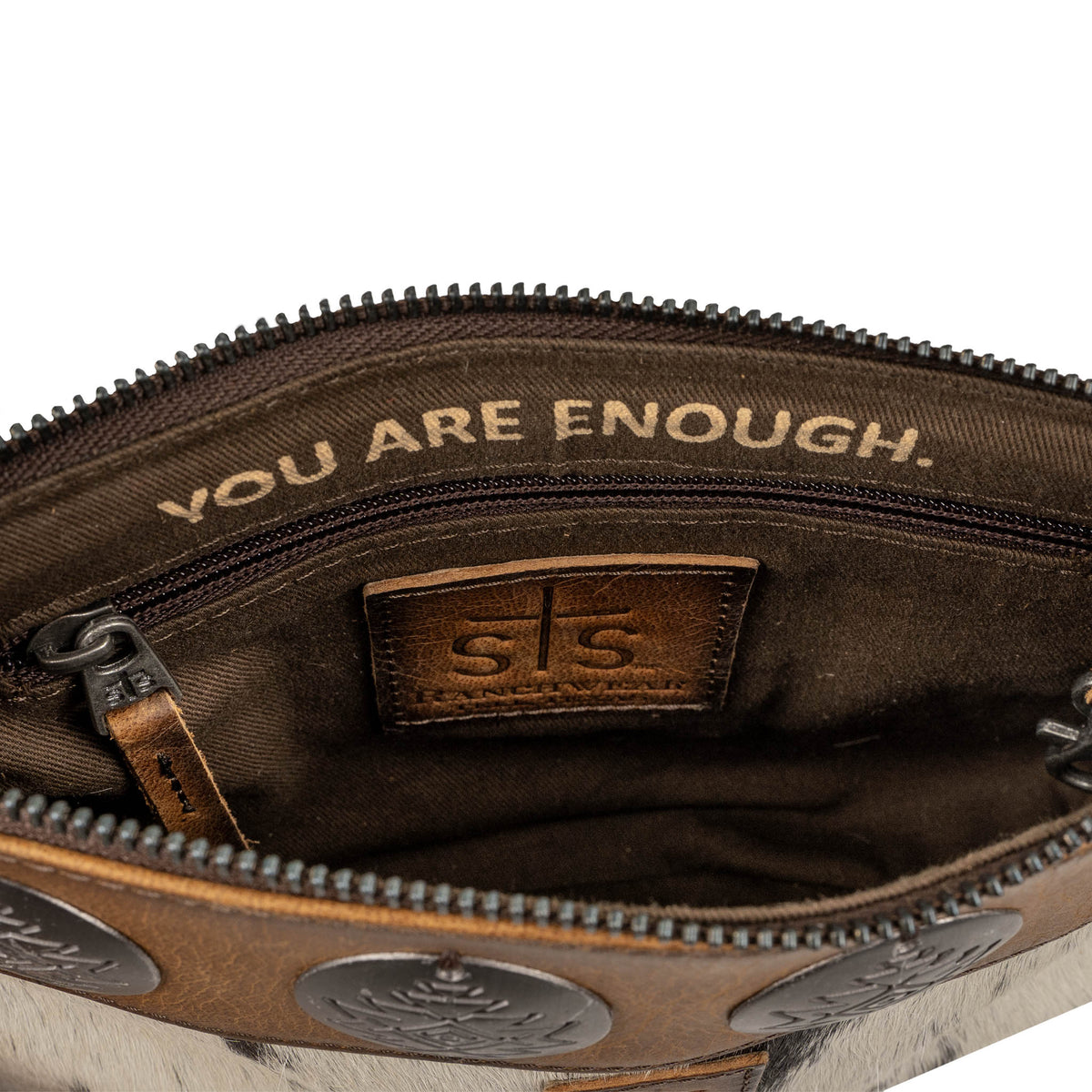 Inside of genuine leather crossbody with zip pocket and inspirational quote "You are enough.".