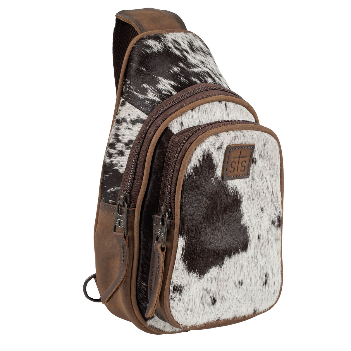 Brown leather sling bag with brown and white cowhide accents and zip closure.