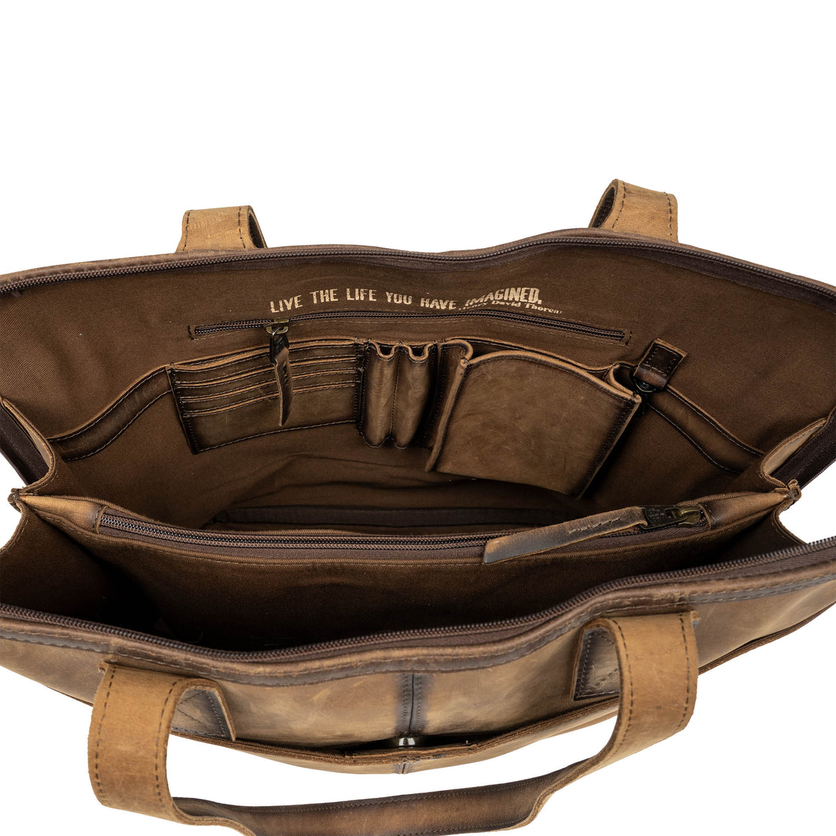 Interior of cowhide leather shopper bag with card slots, pen slots and slip pocket.