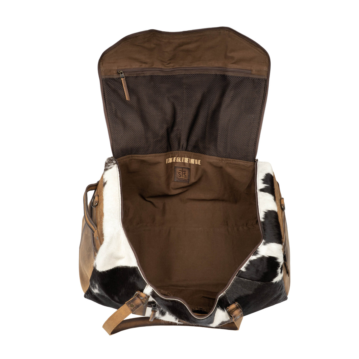 Interior of cowhide duffle bag featuring zip pocket and main compartment.