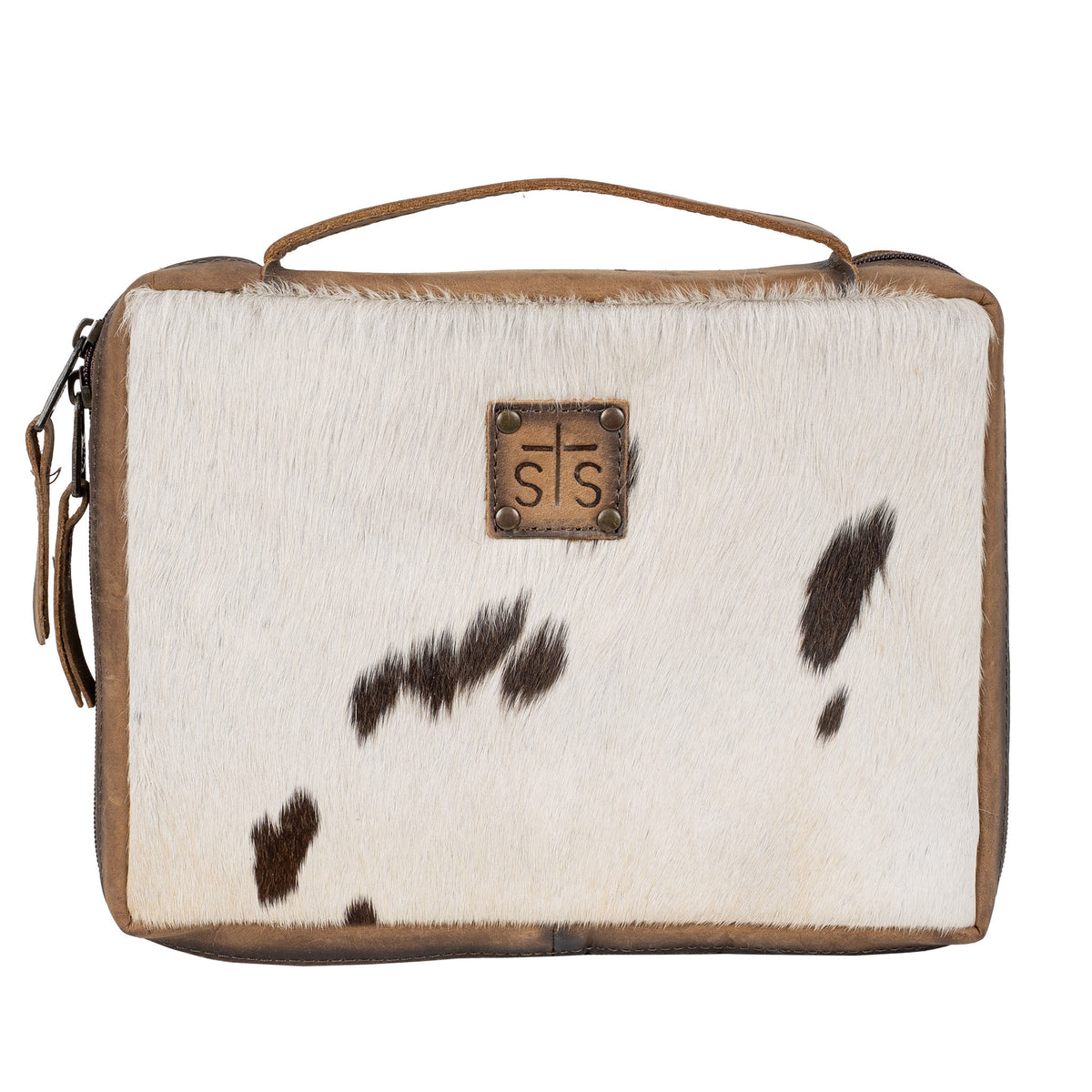 A hair on hide cowhide Bible cover with a multicolor white and brown hair on hide accented exterior and full grain leather trim, featuring a leather handle, zip-around closure, and an STS branded logo patch on a white background.