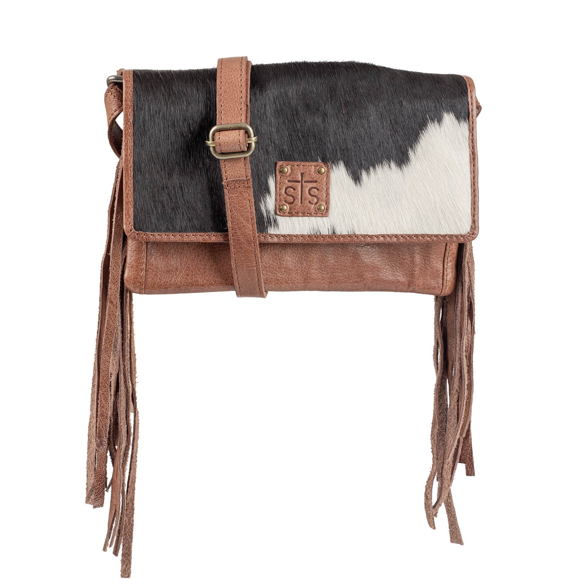 Brown leather handbag with black and white cowhide accents, leather fringe and brown crossbody strap.