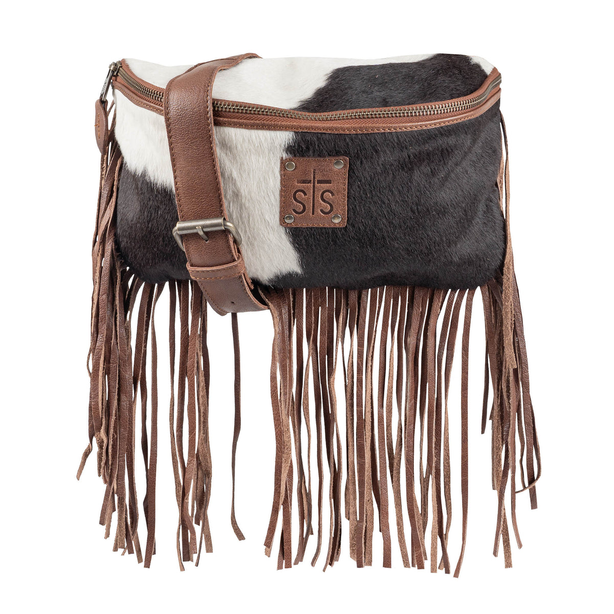 Black and white cowhide belt bag with brown leather fringe and strap on a white background.