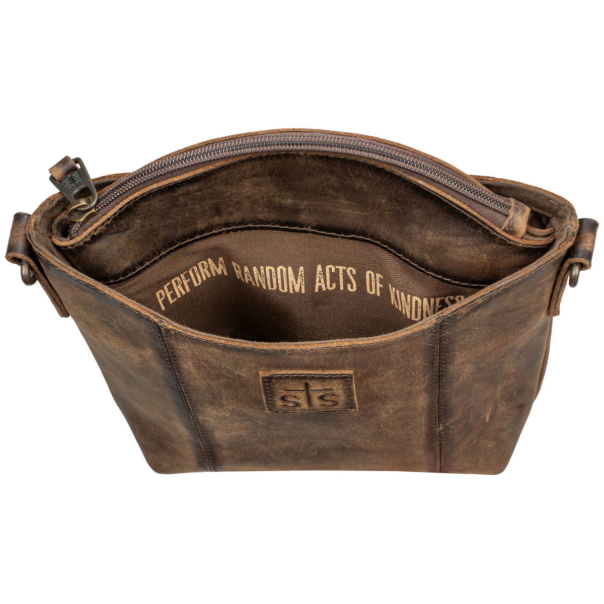 Over head inside view of the storage in a leather crossbody purse on a white background.
