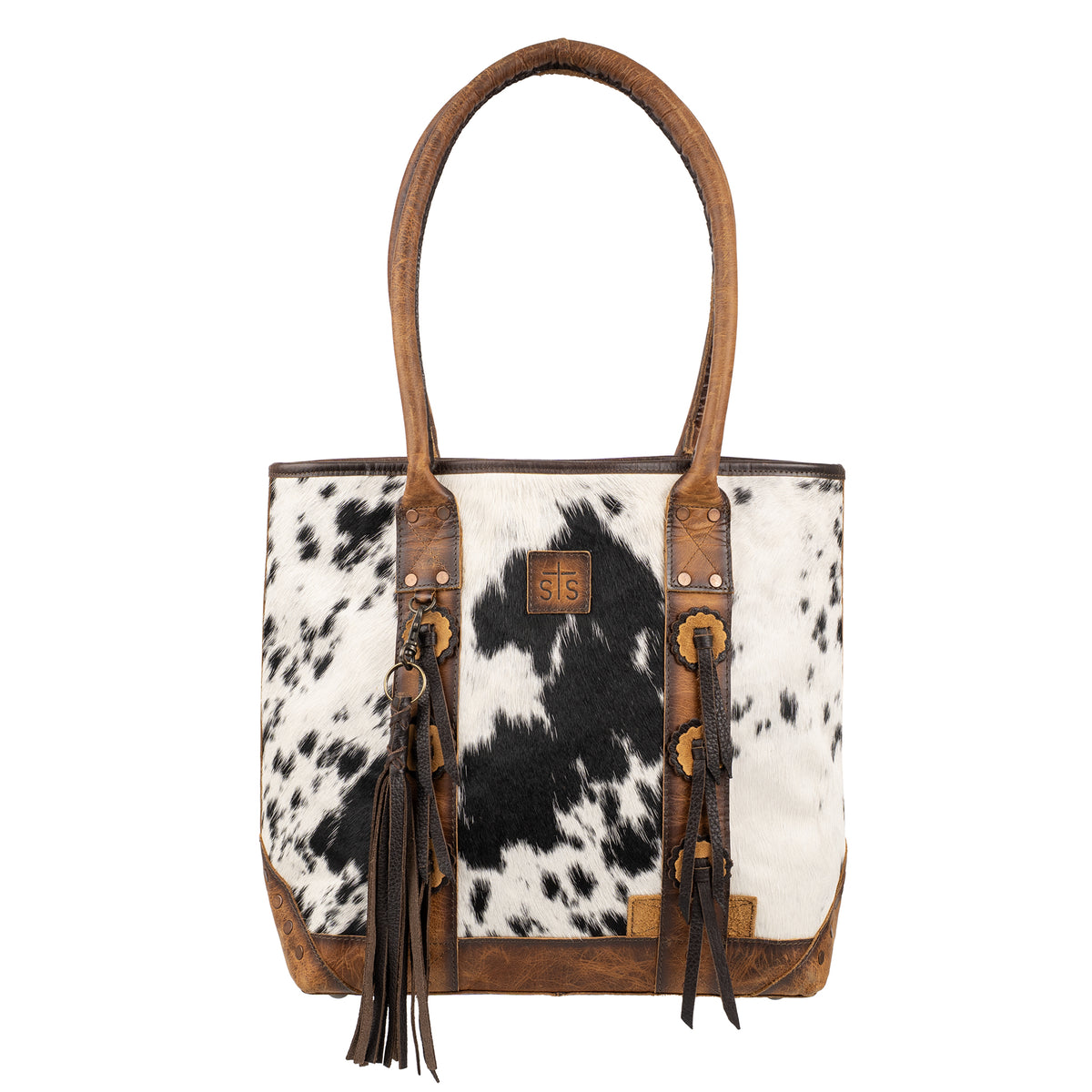 cowhide and distressed full grain leather purse with top zip closure, two top carry handles and removable tassel on white background