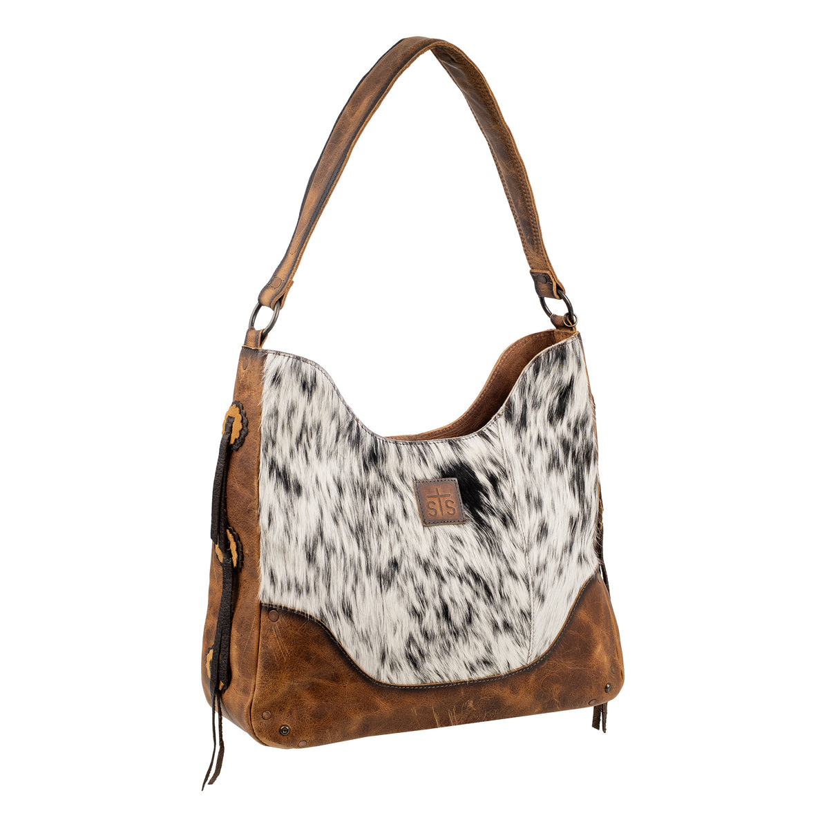 side view of our cowhide and distressed full grain leather purse with top zip closure, shoulder strap and removable tassel on white background