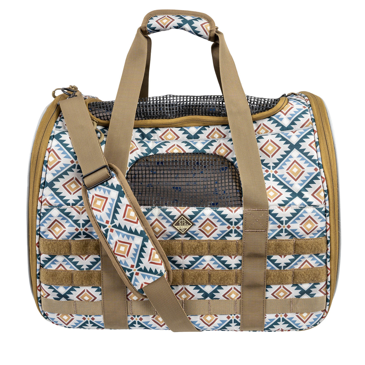 Patterned pet carrier with brown straps and mesh sides on a white background.