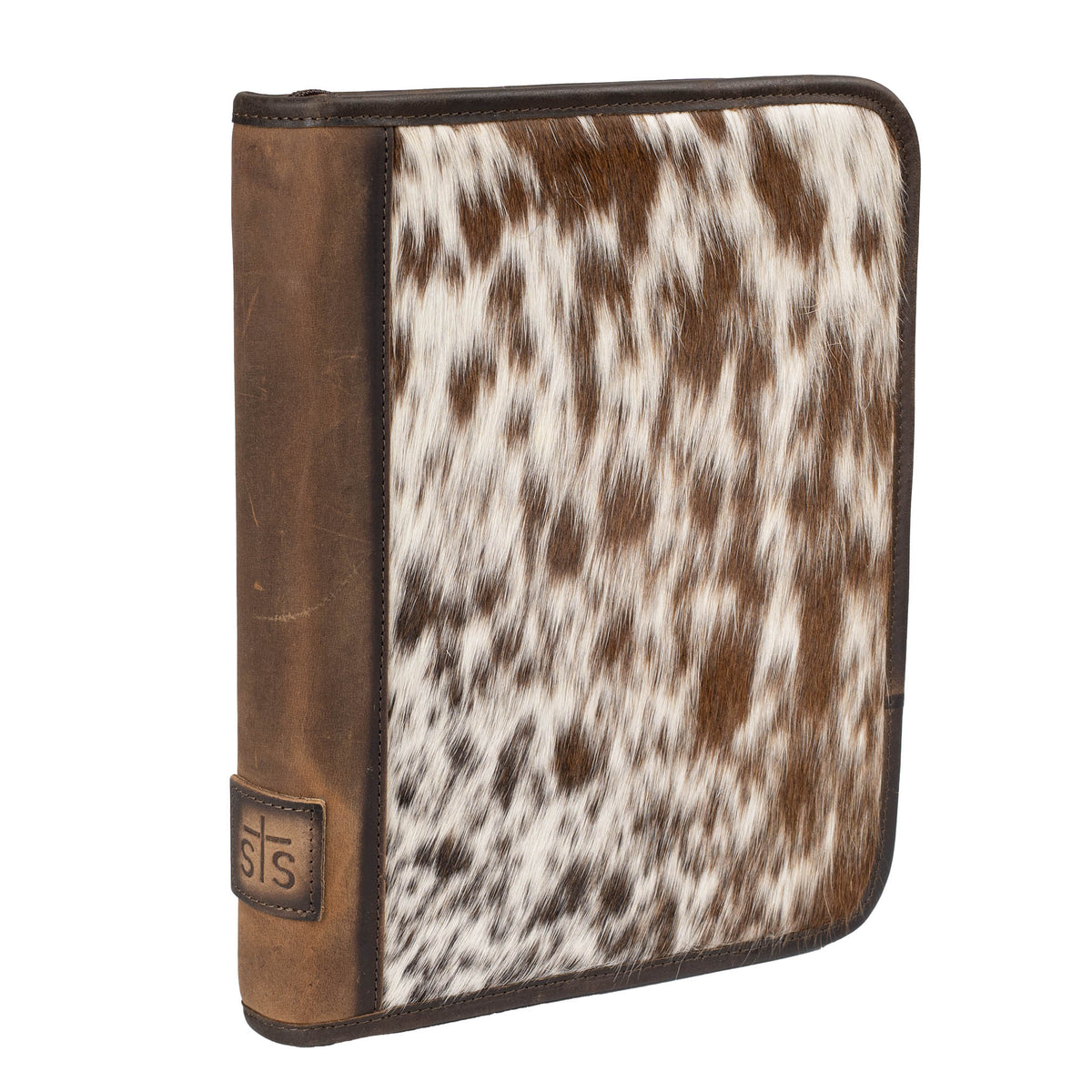 Hair on hide cowhide binder with leather trimming, hair on hide cowhide brown and white accents and leather STS branded patch on the side on a white background.
