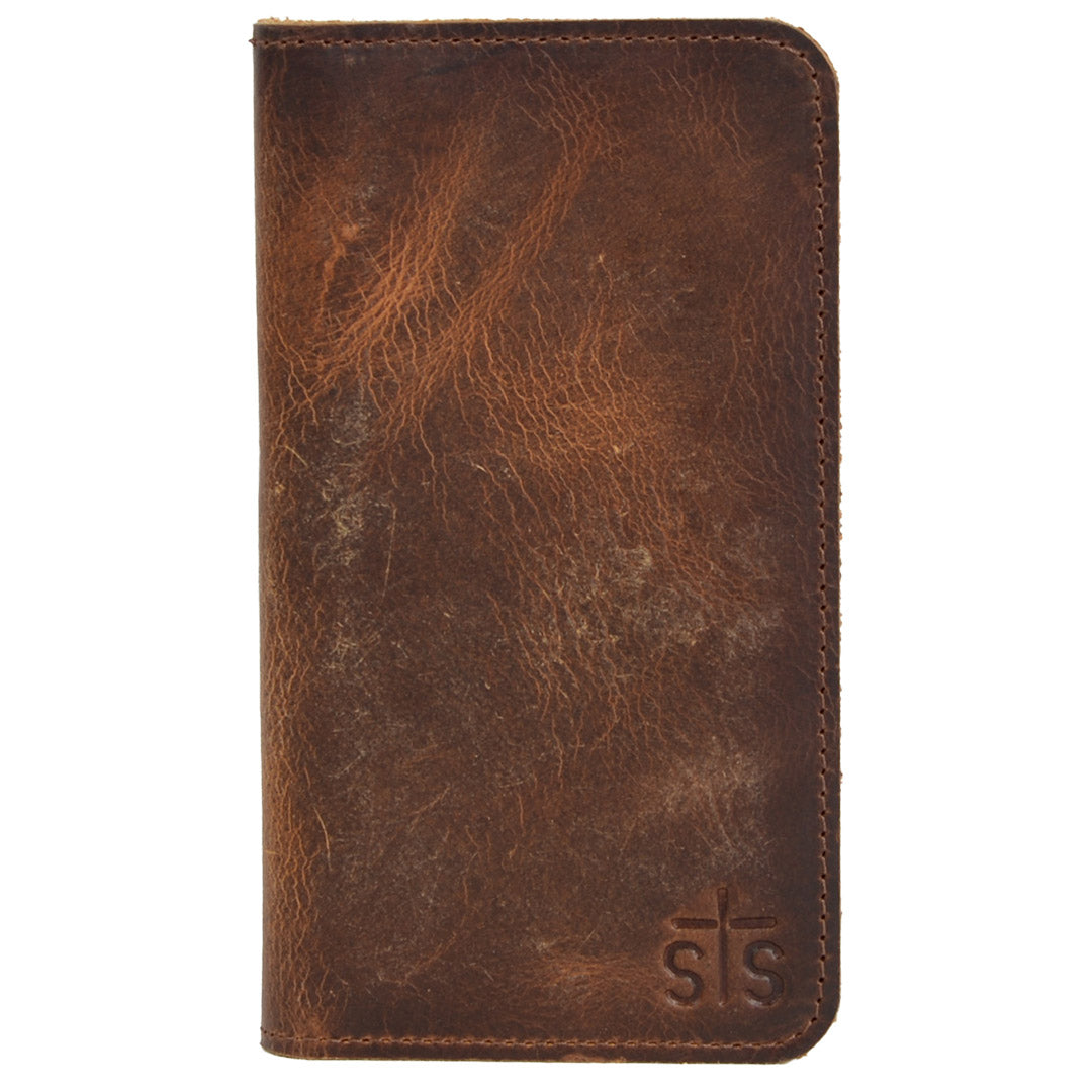 A brown genuine leather checkbook wallet with embossed STS logo on a white background.