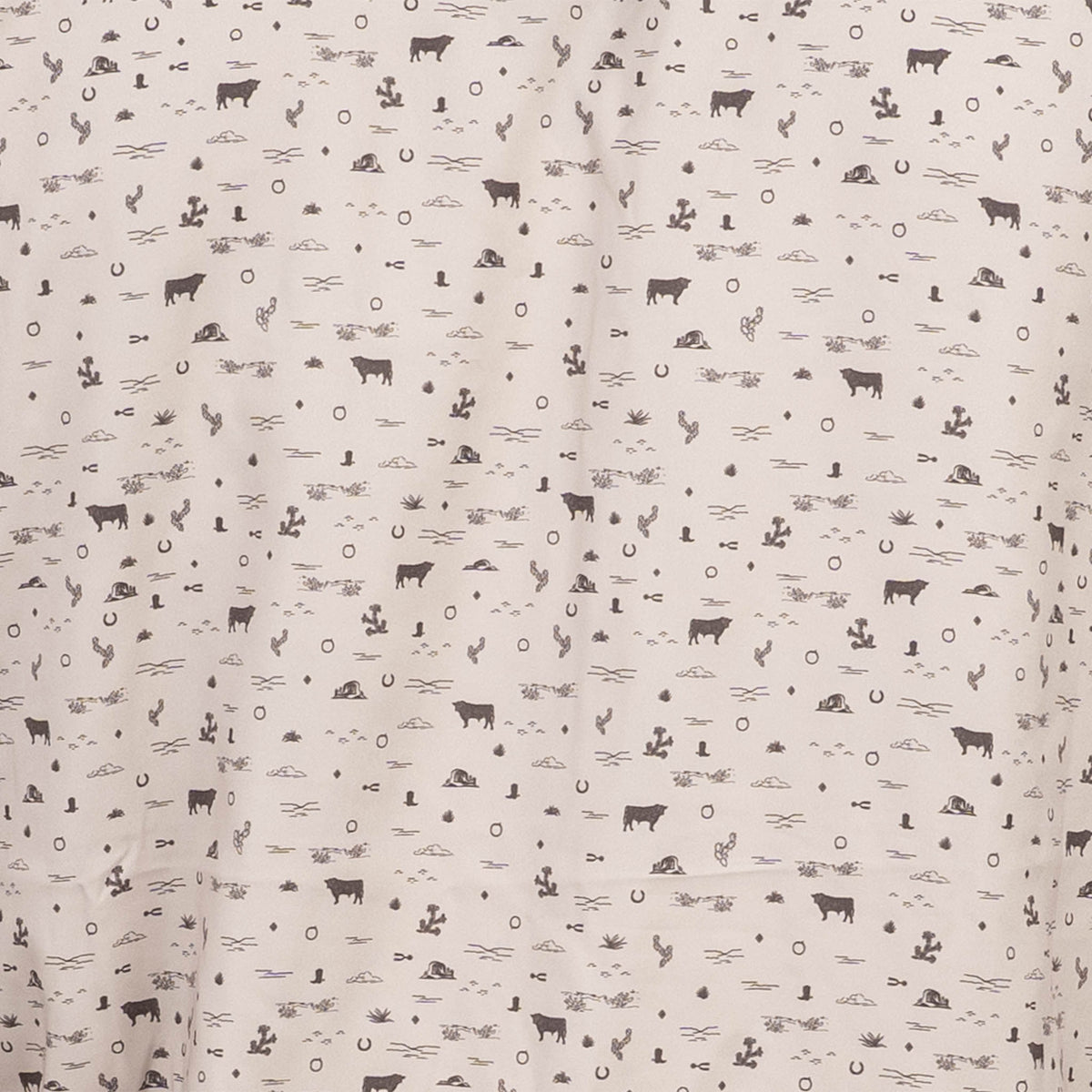 Detail of bull print with cactus and cow silhouettes.