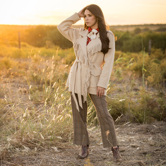 Soni Vest wearing our beige lapel collared jacket with open front with waist tie belt outside