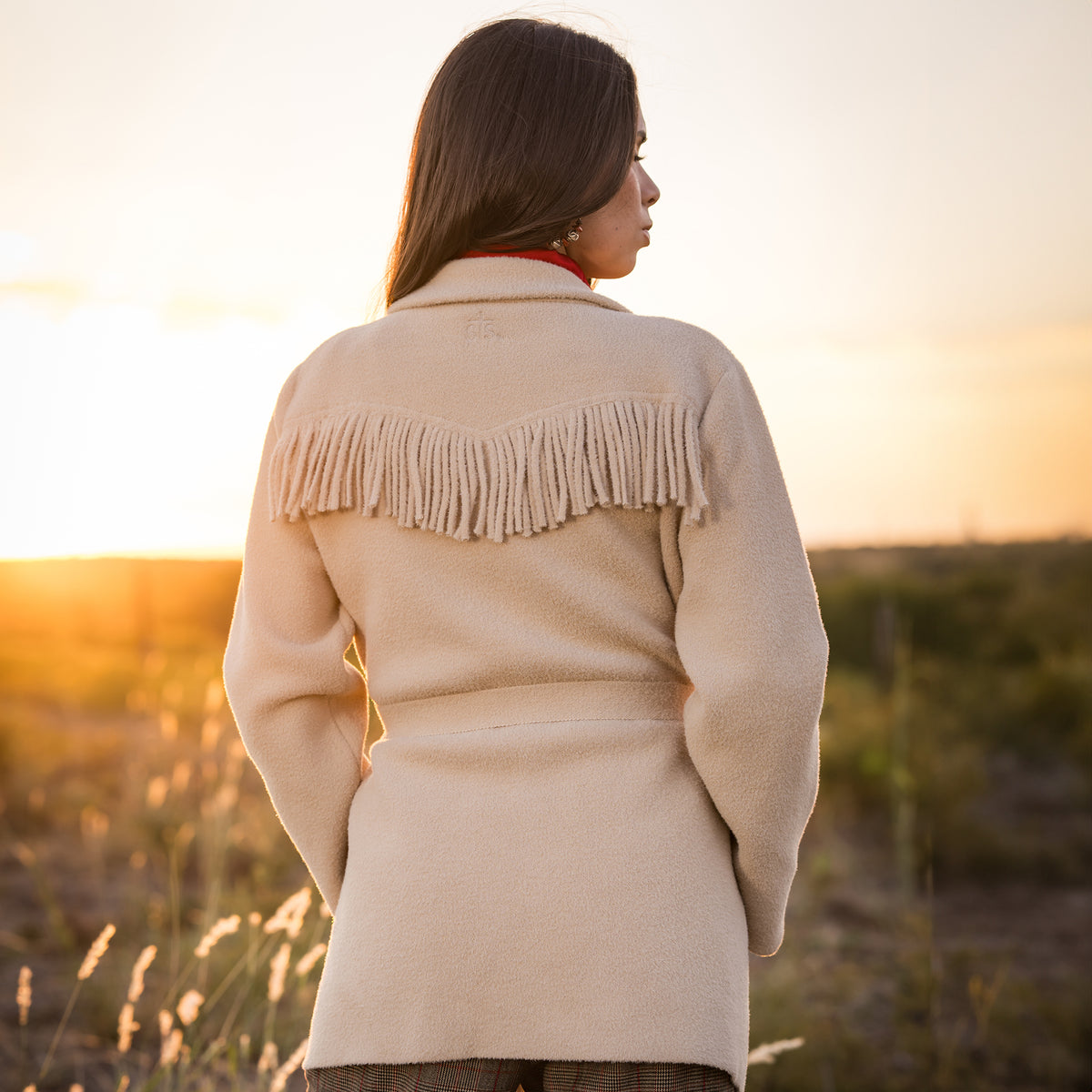 back of Soni Vest wearing our beige lapel collared jacket with open front with waist tie belt outside