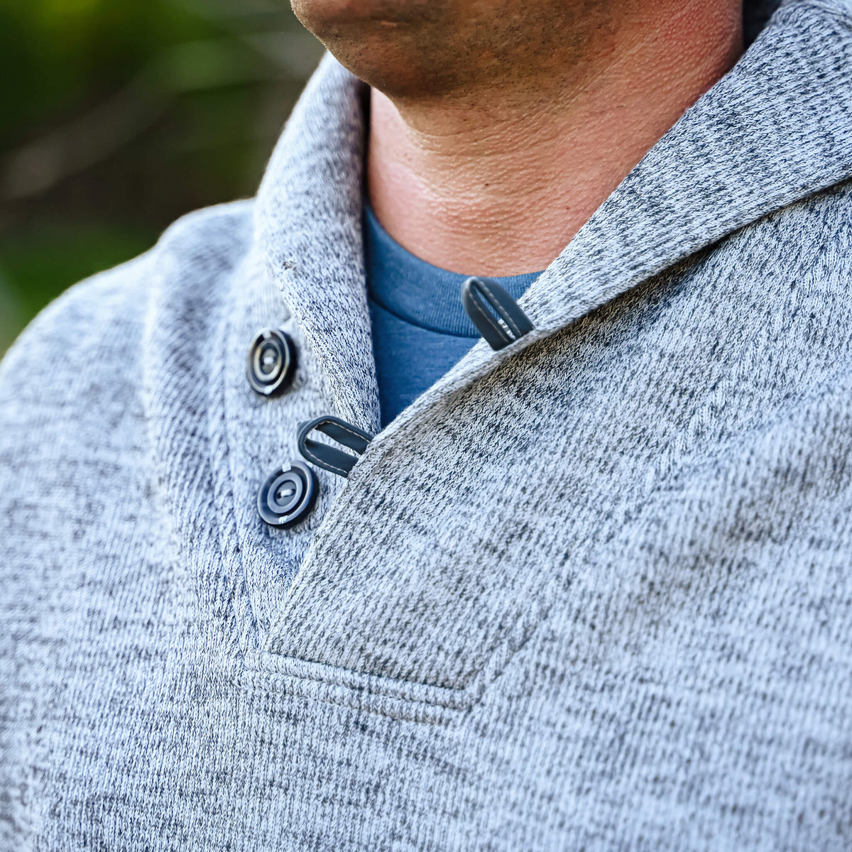 Detail of button cowl neck on men's gray Olathe pullover.
