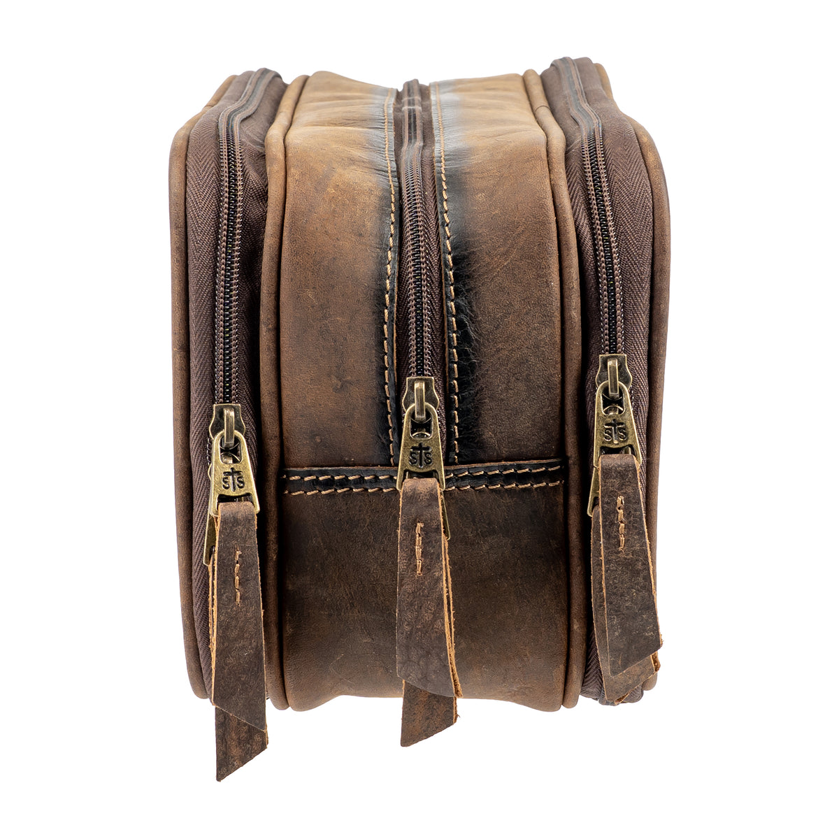 closeup of the side of our canvas bull camo and full grain leather triple zip closure shave kit on white background