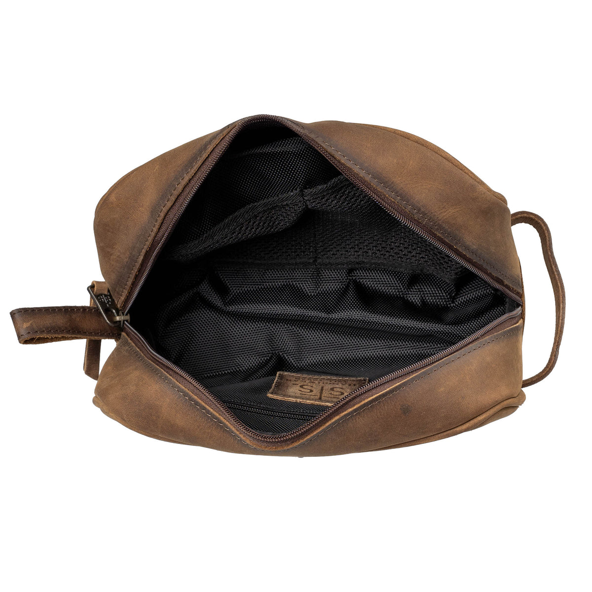 Inside of a brown leather shave kit with canvas lining, zip closure and leather "STS" patch on a white background.