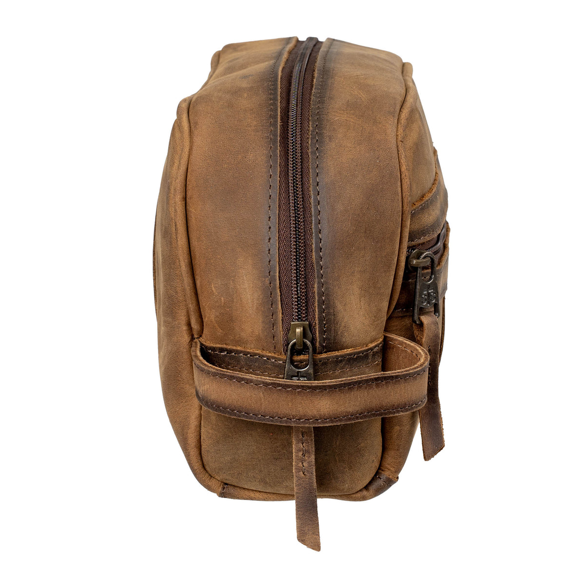 Side of brown leather shave kit with leather handle and YKK zipper on a white background.
