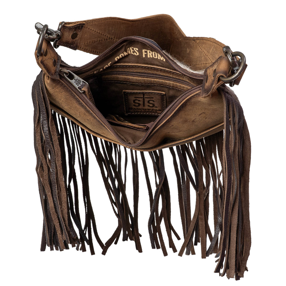 Inside of a genuine leather and hair on hide cowhide shoulder bag with leather fringe and an internal zip closure pocket on a white background.