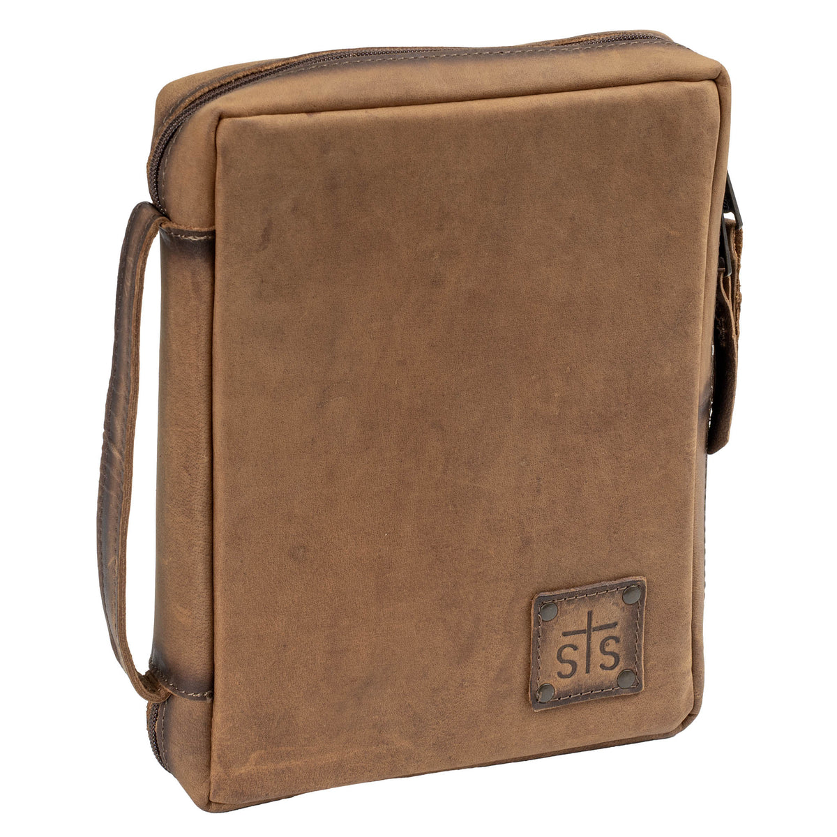 A brown leather Bible cover with a zip-around closure, a leather strap on the spine, and an STS branded logo patch.