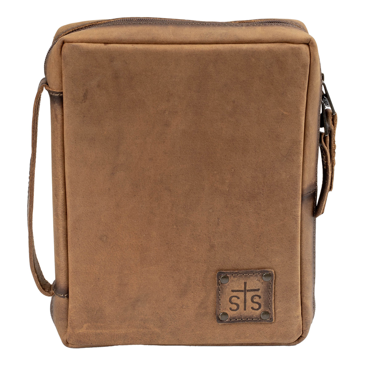 A brown leather Bible cover with a zip-around closure, a leather strap on the spine, and an STS branded logo patch.