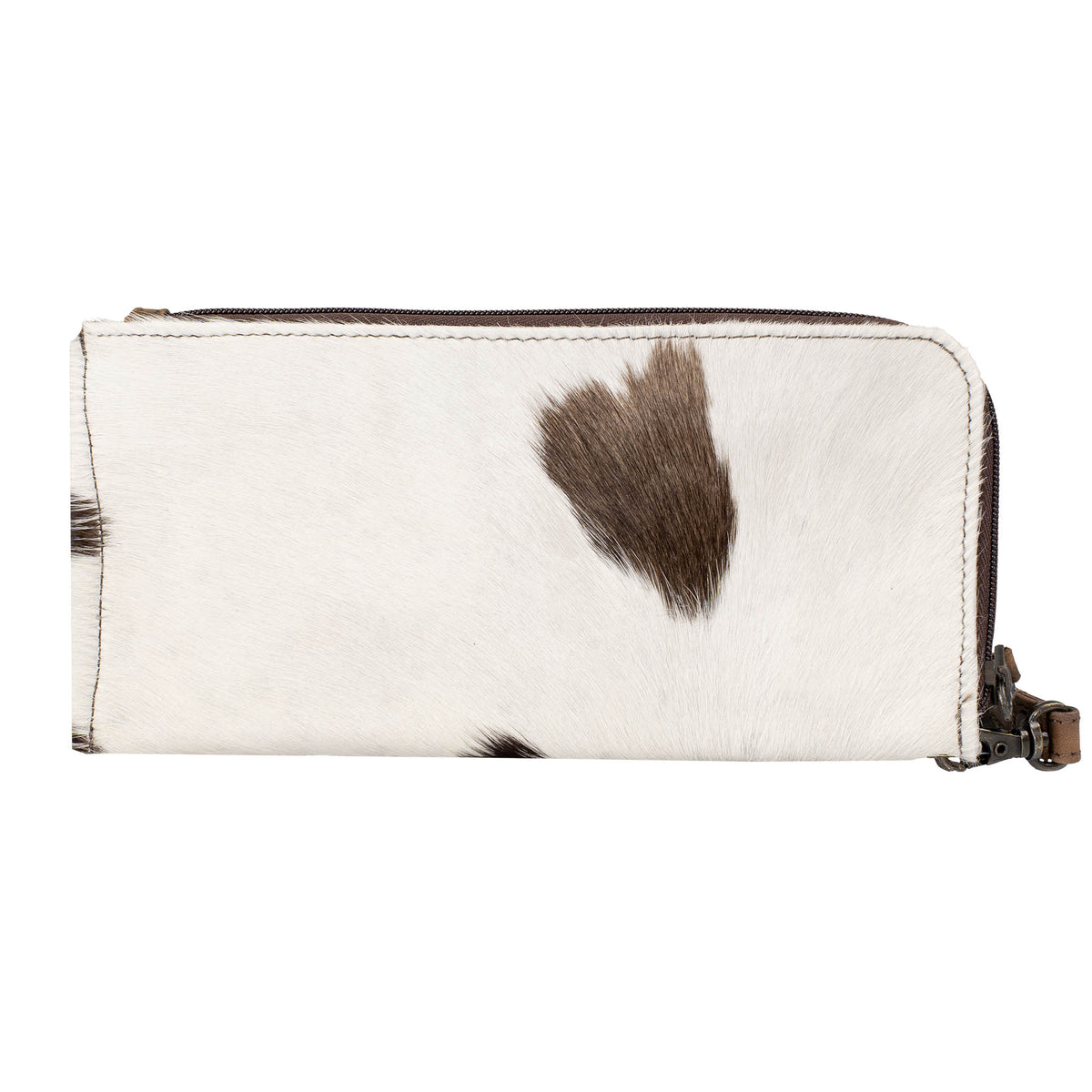 White hair on hide cowhide wallet with black spots and brown accents, zip around closure and leather wristlet strap on a white background.
