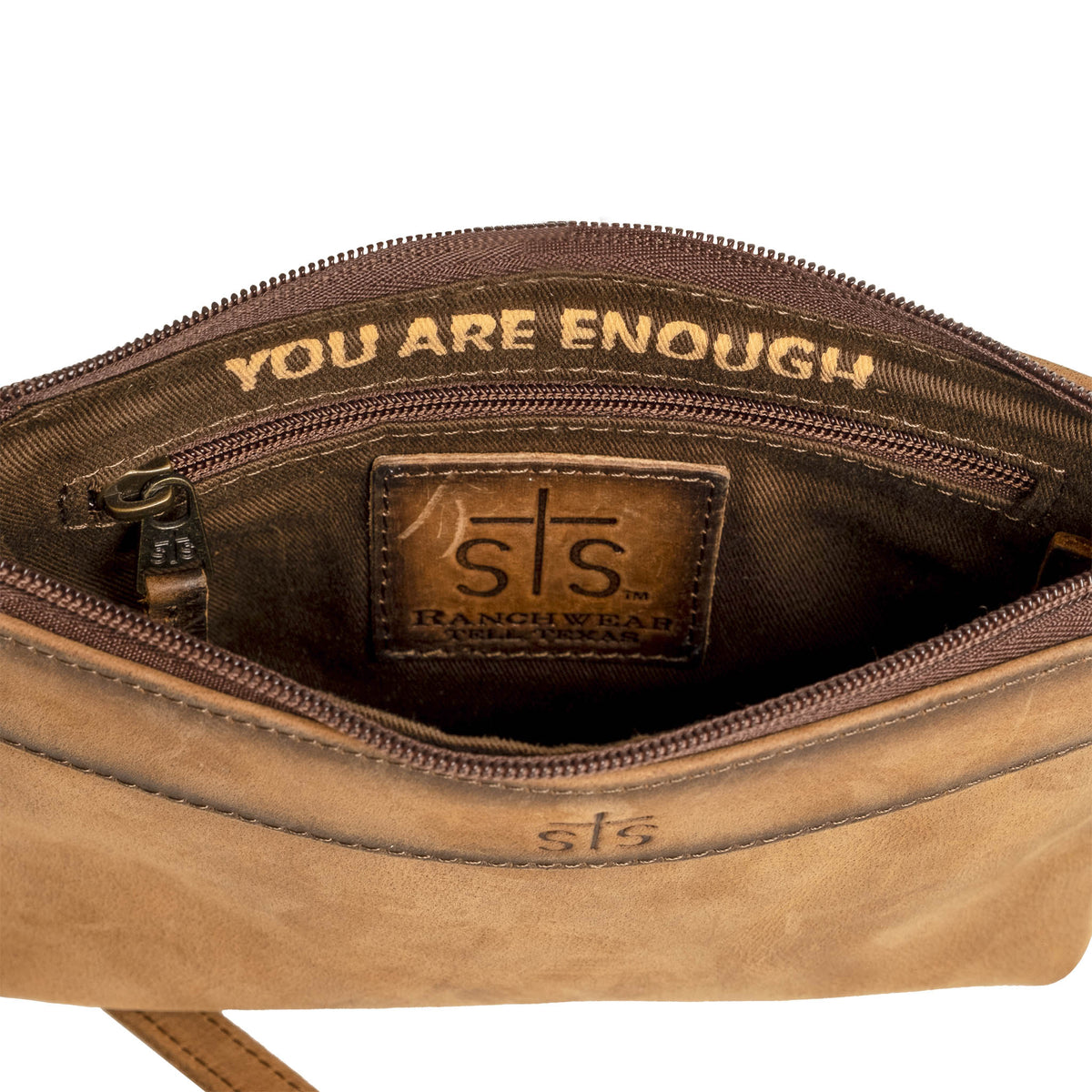 Inside view of brown genuine leather crossbody purse with zip pocket, brown leather patch with STS Ranchwear embossed logo and inspirational quote "You are enough".