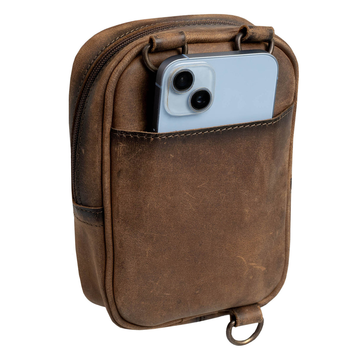 Back side view of a phone inside of the back slip pocket of a leather crossbody purse on a white background.