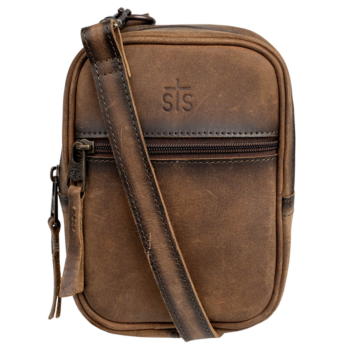 Closeup of an STS embossed leather crossbody with front zipper pocket and zip around closure on a white background.