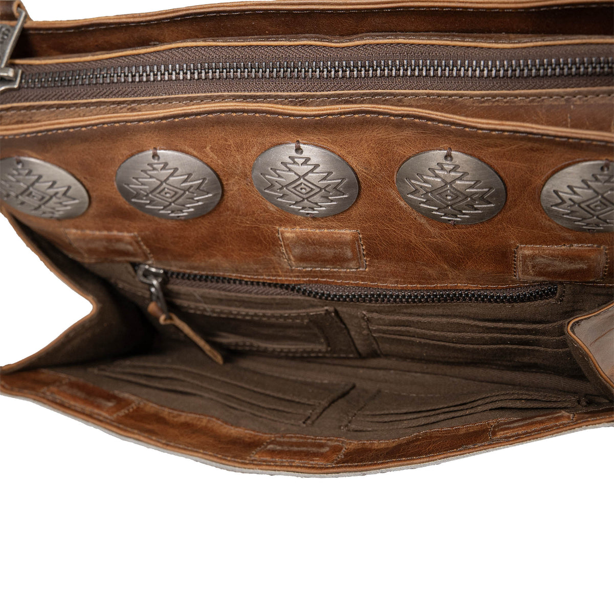 External magnetic closure pocket on leather crossbody featuring an ID slot, zip pocket and card slots.