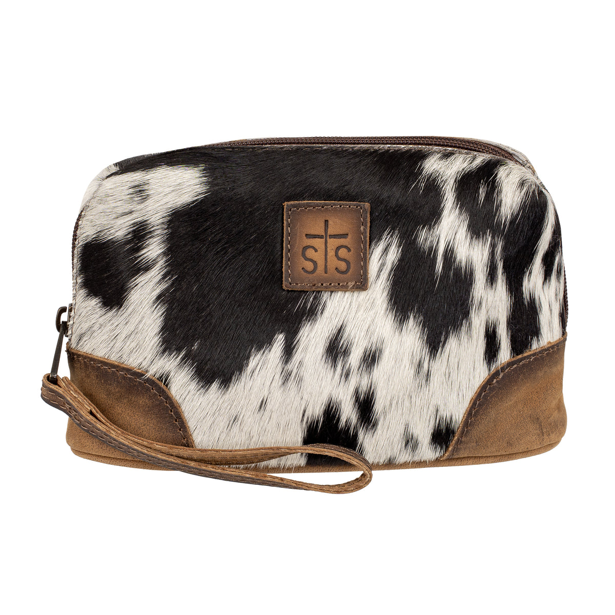 A small zippered cosmetic pouch with a black and white cowhide pattern, brown leather trim, and a brown leather patch featuring embossed STS logo.