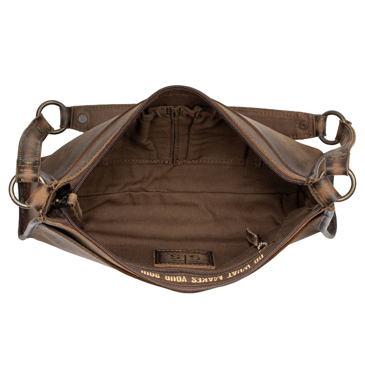 Overhead open view of a leather shoulder bag on a white background. 