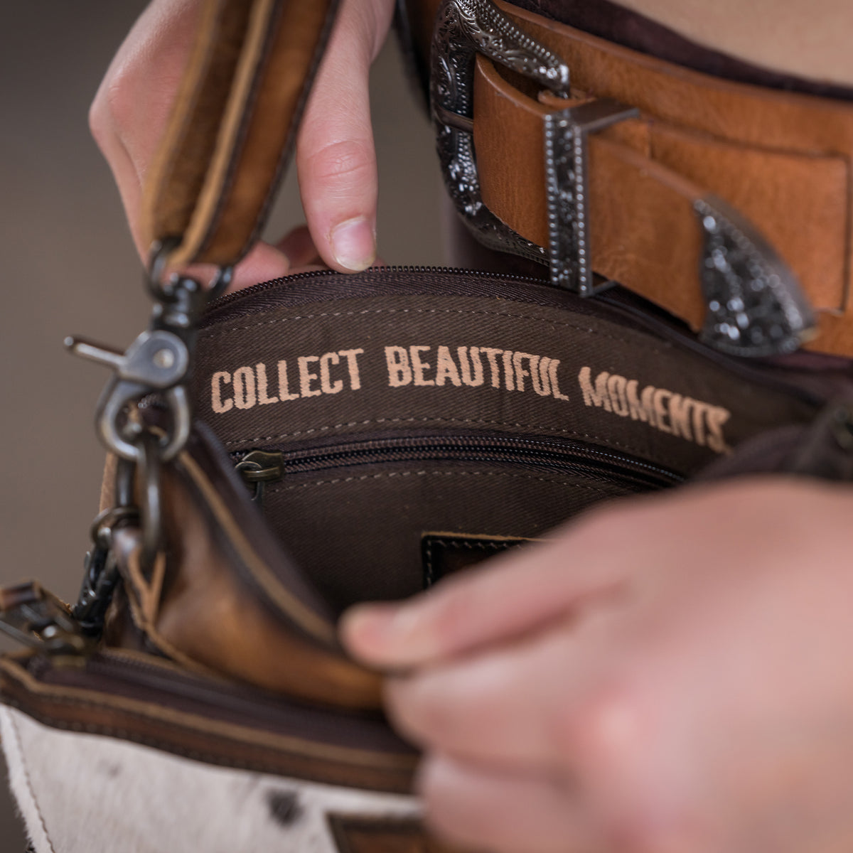 open view of our Cowhide and distressed full grain leather purse with multiple zip closures and adjustable crossbody strap