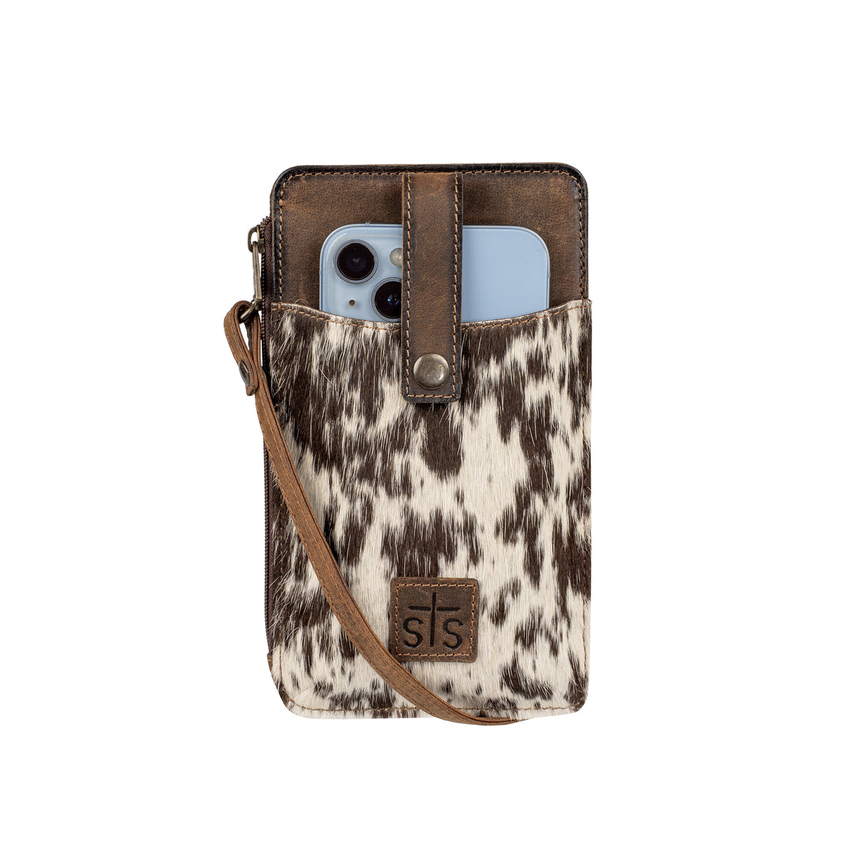 Brown leather phone sling with cowhide accents, snap flap for phone and adjustable crossbody strap.