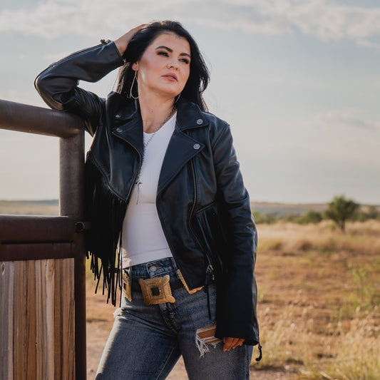 Whitney Vest on STS Ranch wearing our black leather jacket with fringe detailing and asymmetrical zipper front closure 
