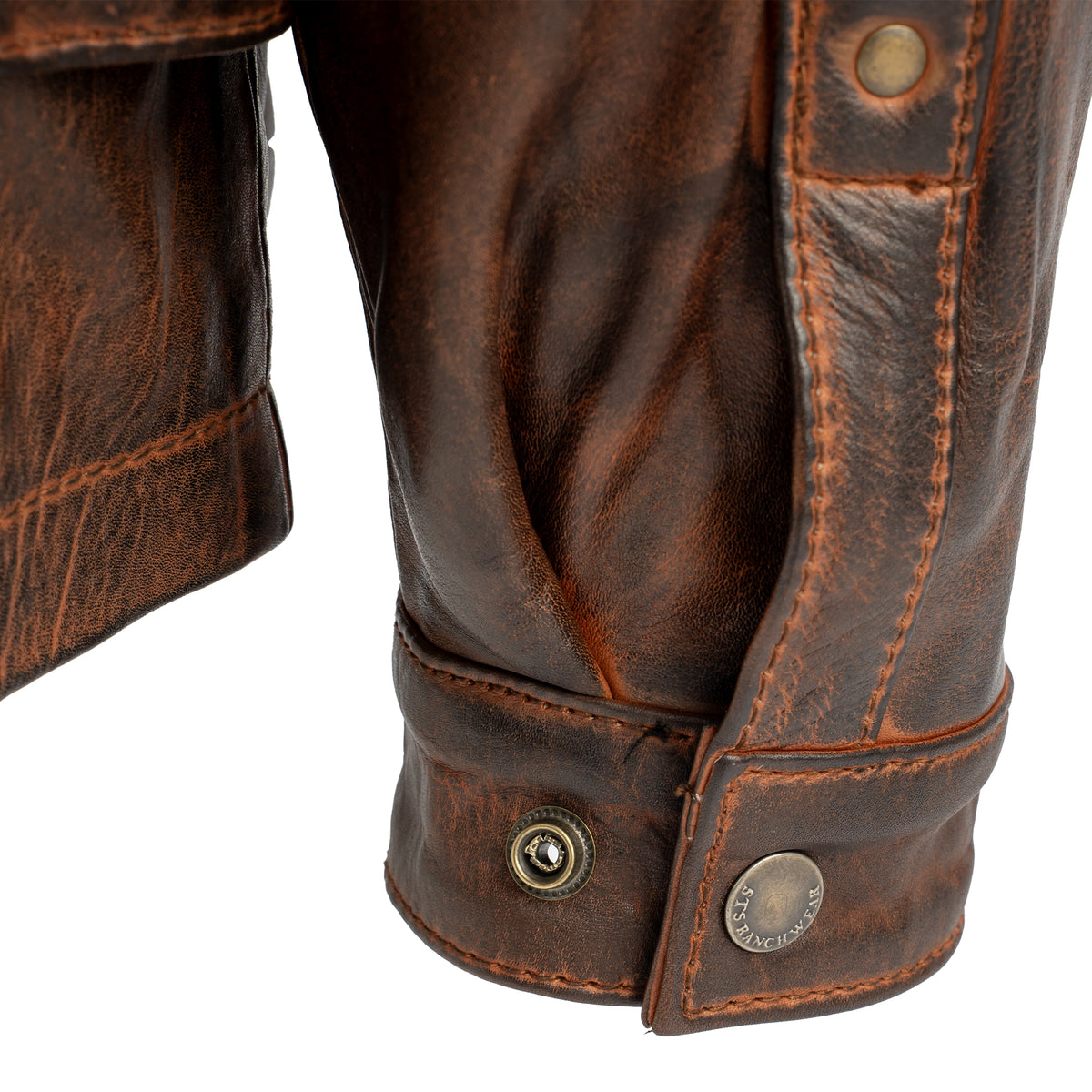 closeup of the cuff on our deep bay leather jacket with a front zipper, classic western yoke and hand warming pockets on white background