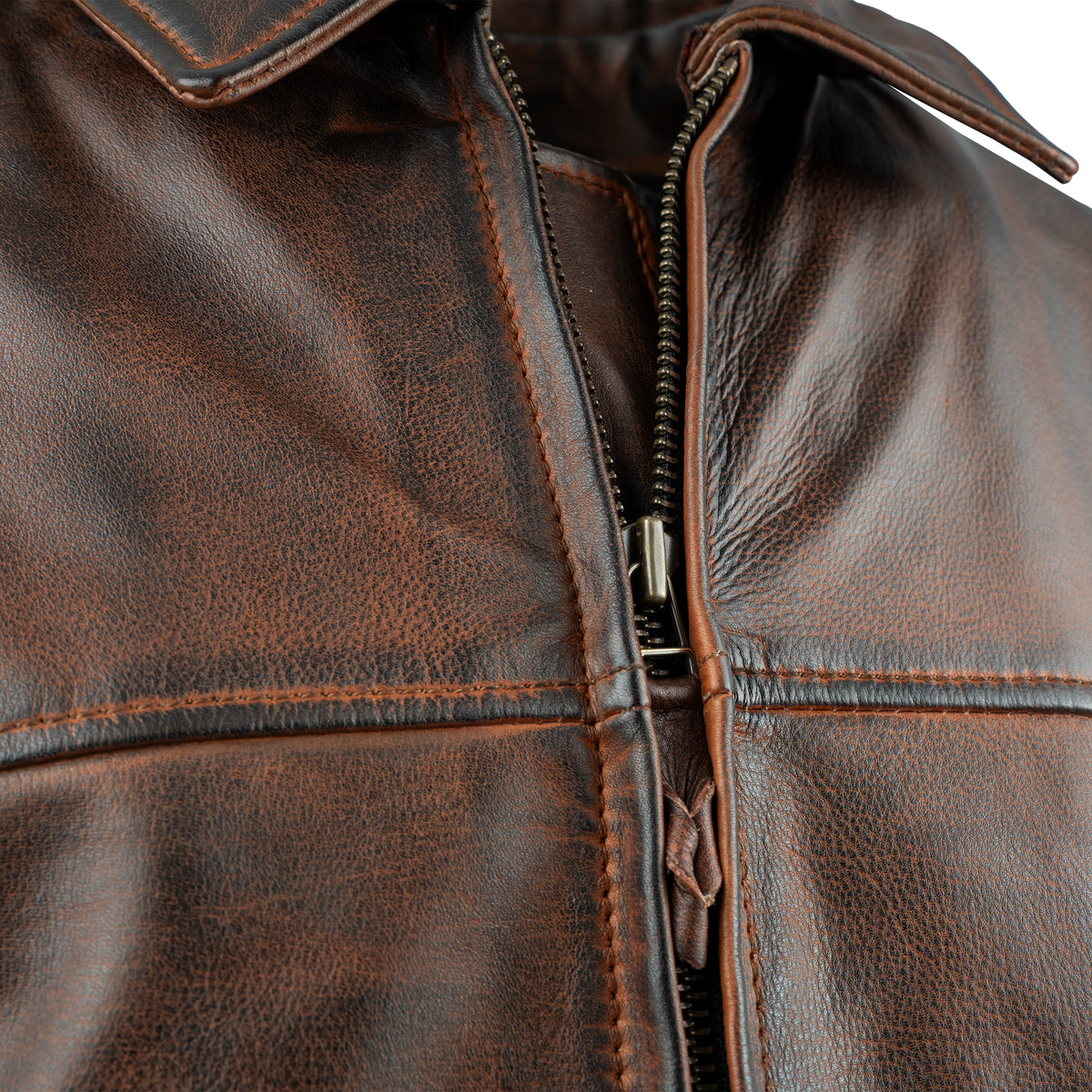 closeup of the zipper on our deep bay leather jacket with a front zipper, classic western yoke and hand warming pockets on white background
