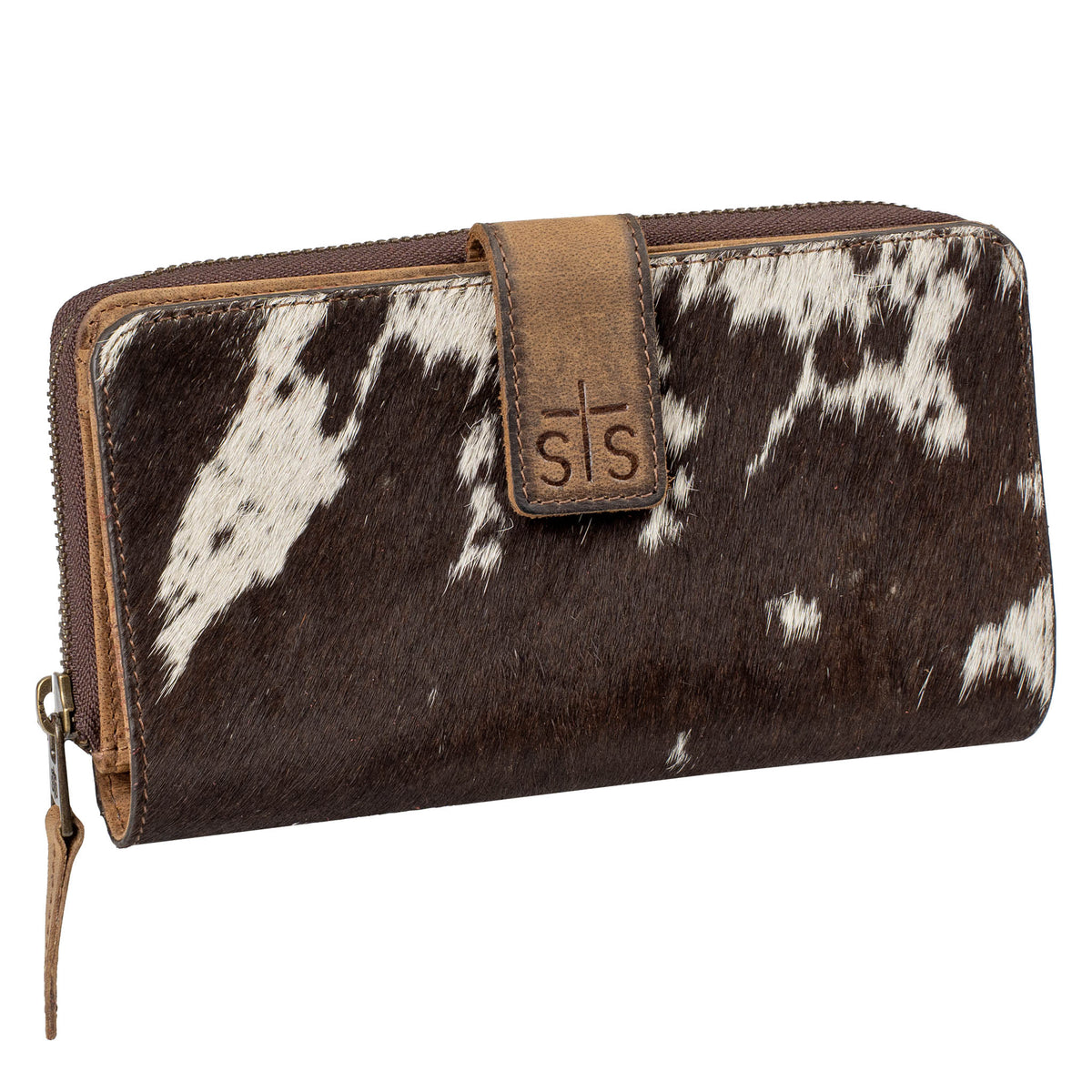Brown and white cowhide wallet leather tab with STS logo and zip around closure on a white background.
