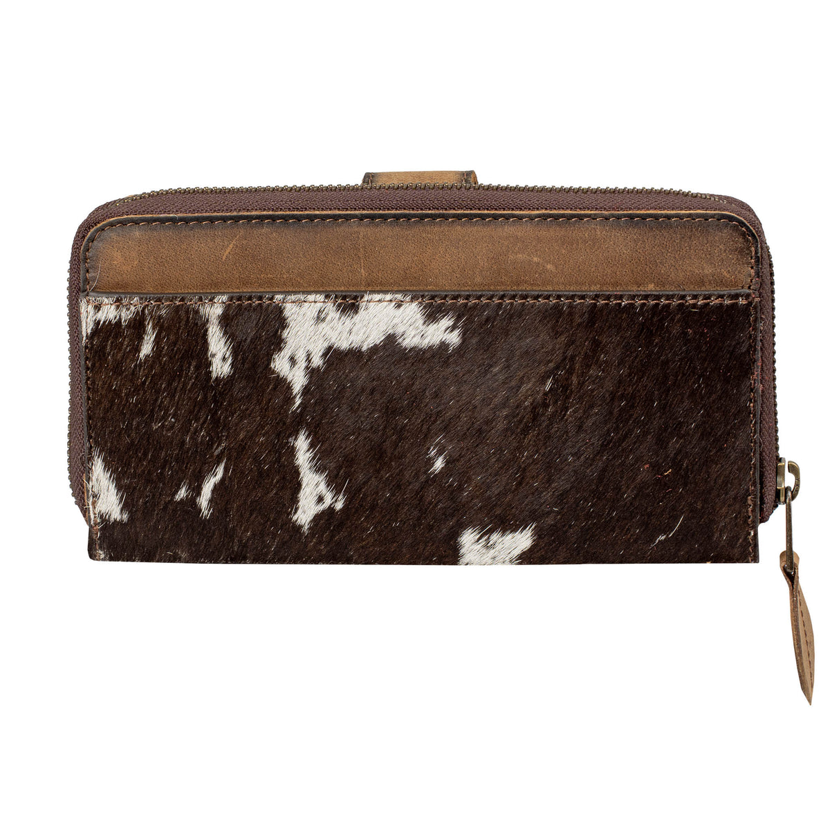 Brown and white cowhide wallet with zip around closure on a white background.