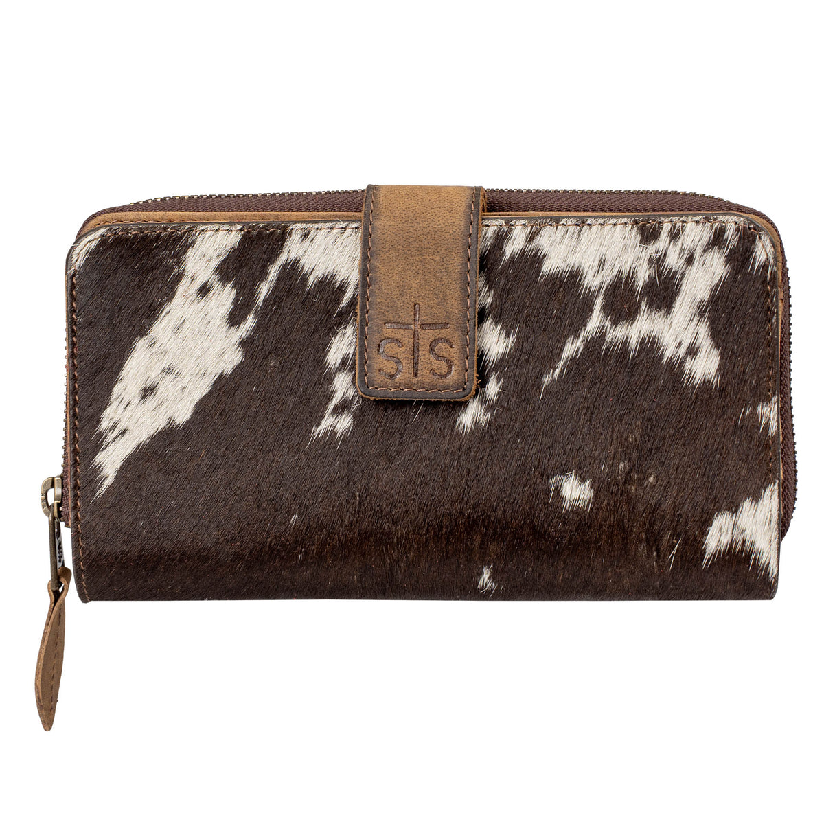 Brown and white cowhide wallet with leather tab with STS logo and zip around closure on a white background.