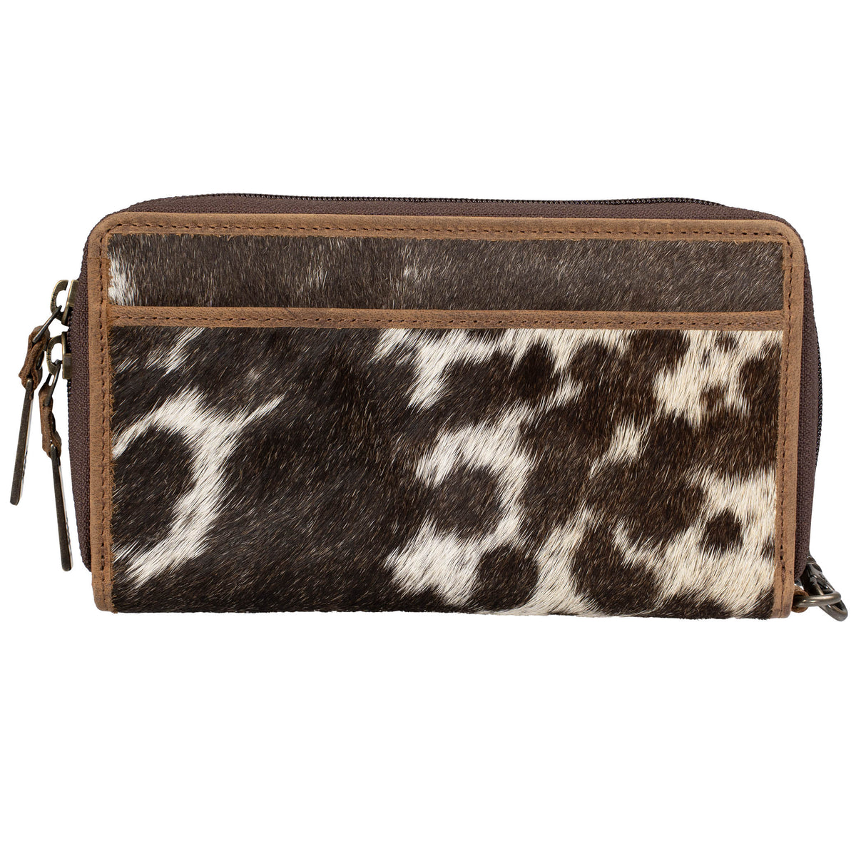 Brown genuine leather wallet with cowhide pattern hair on hide exterior, leather wristlet strap, zip around closure  and slip pocket on a white background.