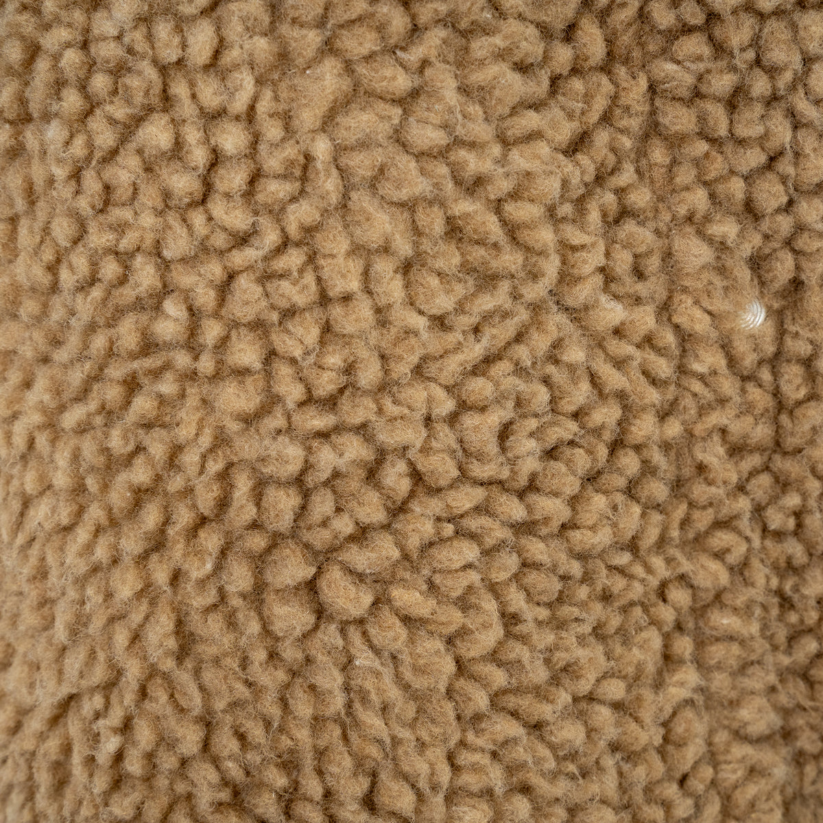 closeup of the sherpa on our light wash denim lined with sherpa, two chest pockets and front button closure jacket