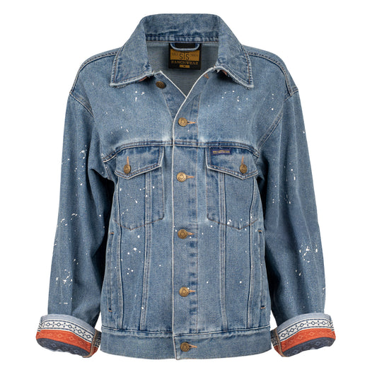 Spackled denim button closure jacket with western patterned sleeve detailing.
