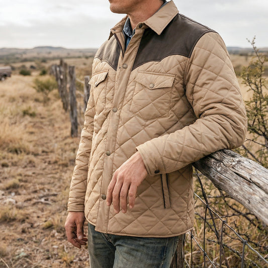 closeup of a man on sts ranch wearing our khaki quilted shell jacket with satin lining, leather western yoke and collar, and chest pockets