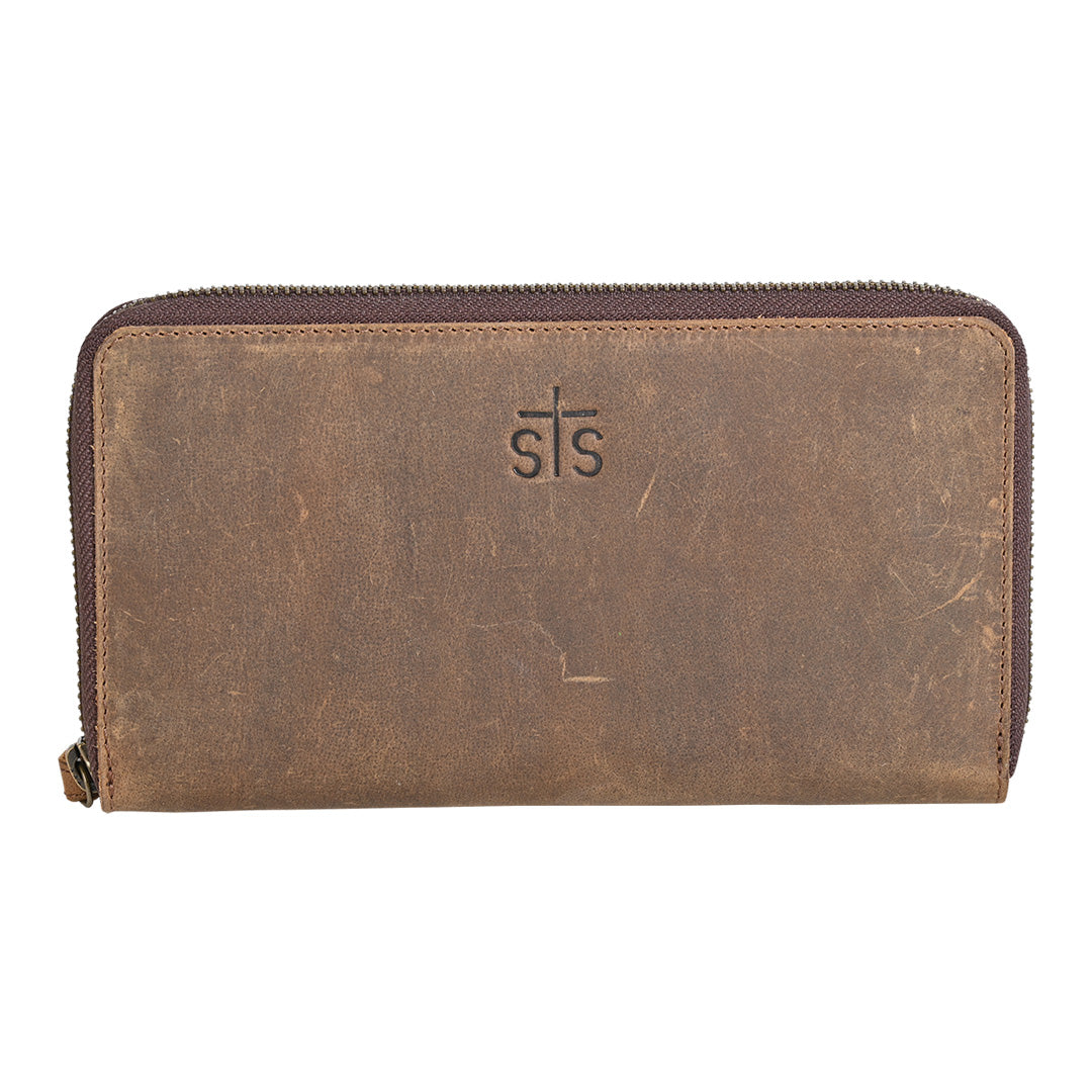 A brown cowhide Bentley wallet with genuine leather accents and zip around closure and the STS logo stamped into the leather on a white background.